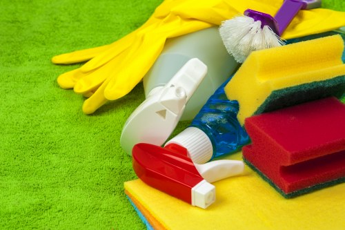 Cleaner wearing protective gloves and PPE during carpet cleaning